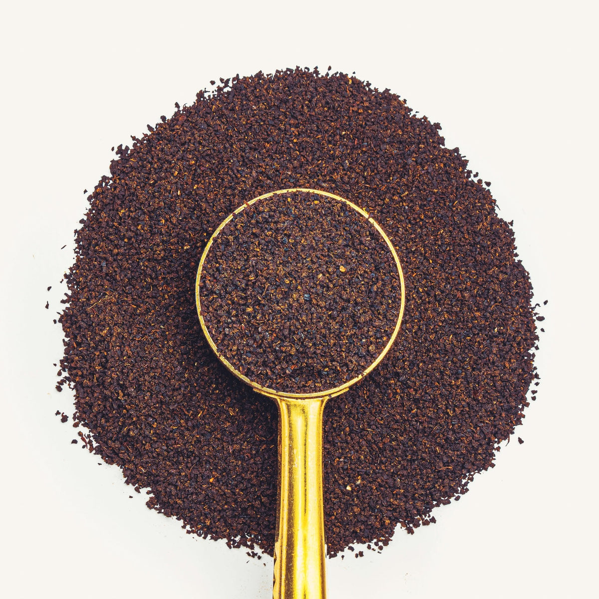 Lakeland Special loose tea in a brass scoop, seen from above; packaging not shown